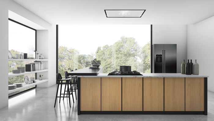 Cucina a scomparsa moderna con isola centrale e design minimalista in open space luminoso